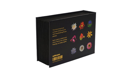 Rückseite des Postkartenbuchs The Blooming Book mit schwarzem Einband und neun farbigen Blütenmotiven.