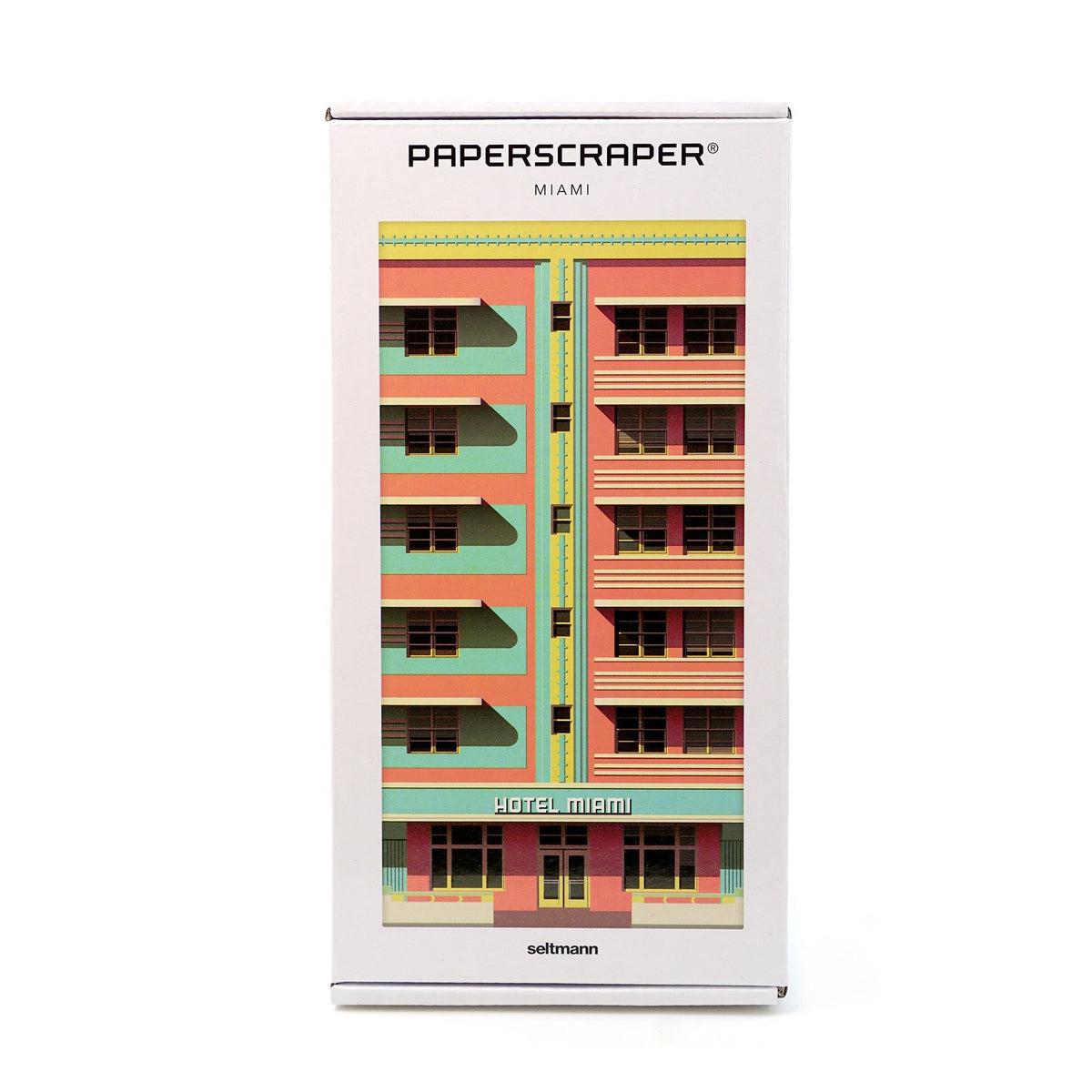 Weiße Verpackung des Paperscraper Miami mit farbenfroher Hotel-Fassade in Rosa und Türkis.