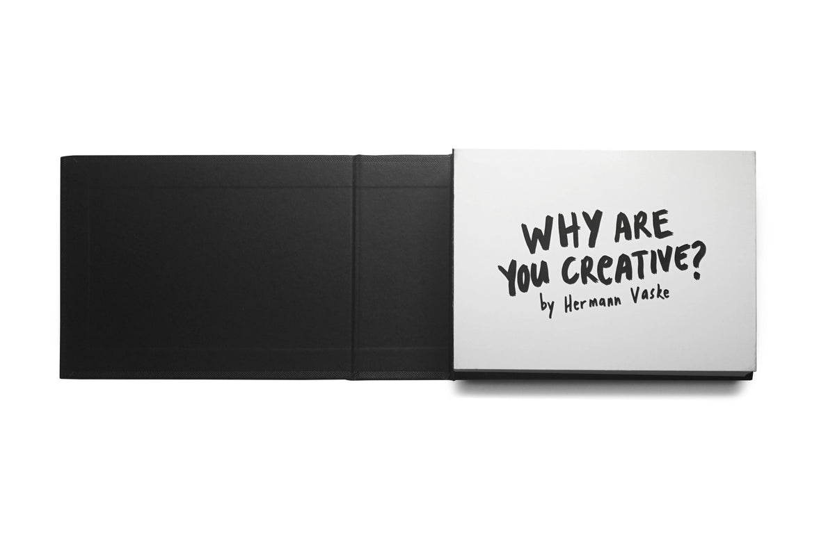 Aufgeschlagenes Buch Why Are You Creative? von Hermann Vaske mit schwarzem Innenumschlag und weißem Titelblatt.